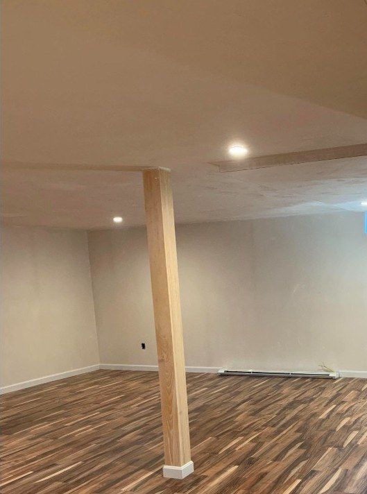 After: basement finishing with new flooring and wrapped column