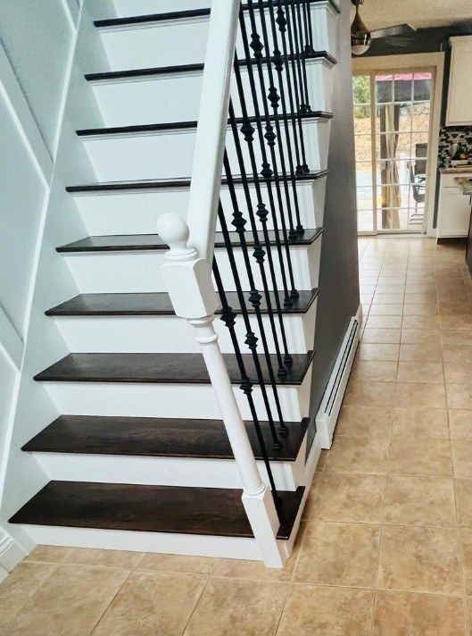Before: foyer floor tile replacement by the staircase in Marlborough, MA
