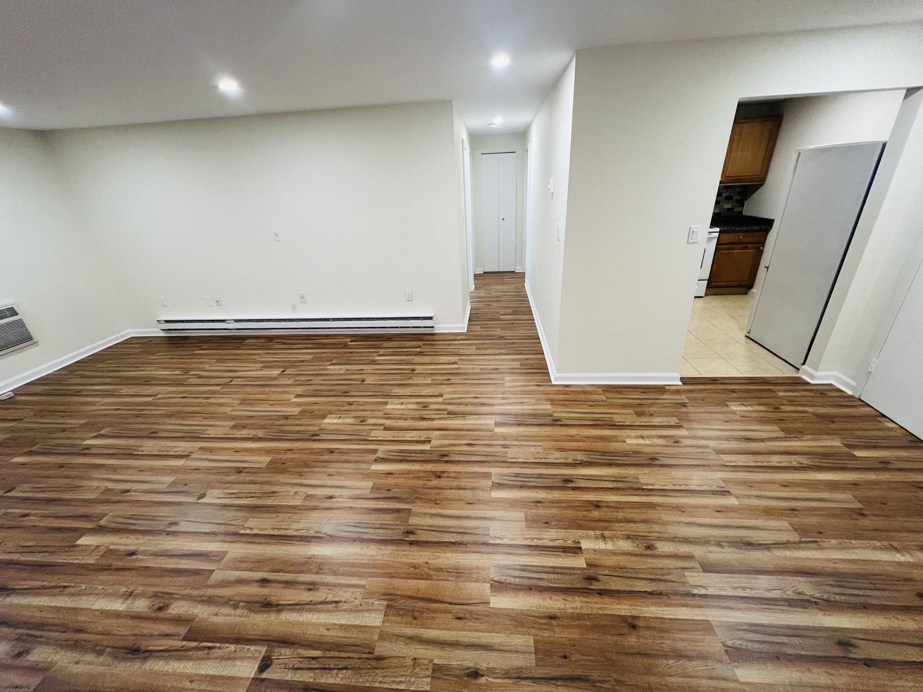 Finished basement living area with laminate floor