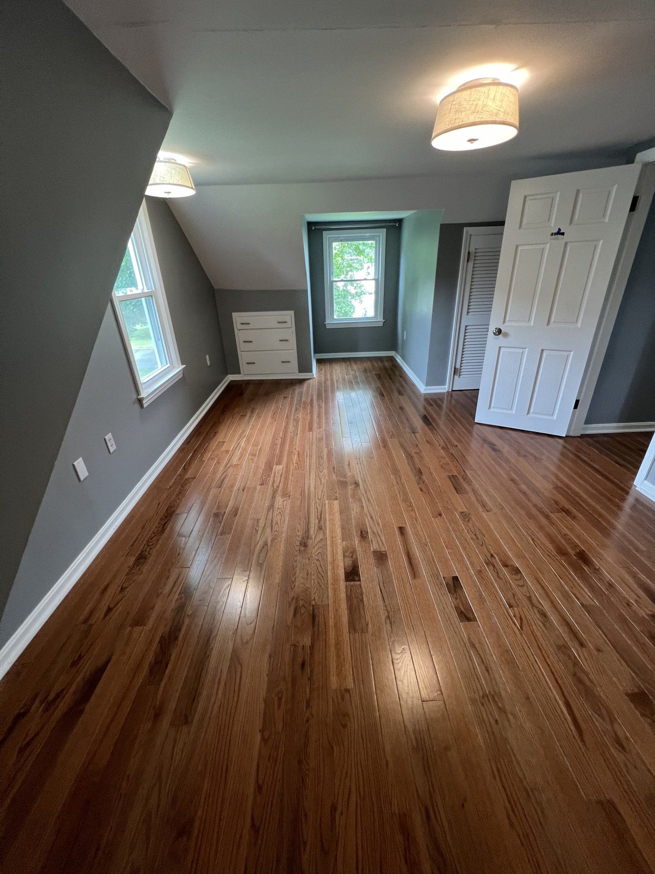 Painted bedroom walls and trim over refinished hardwood