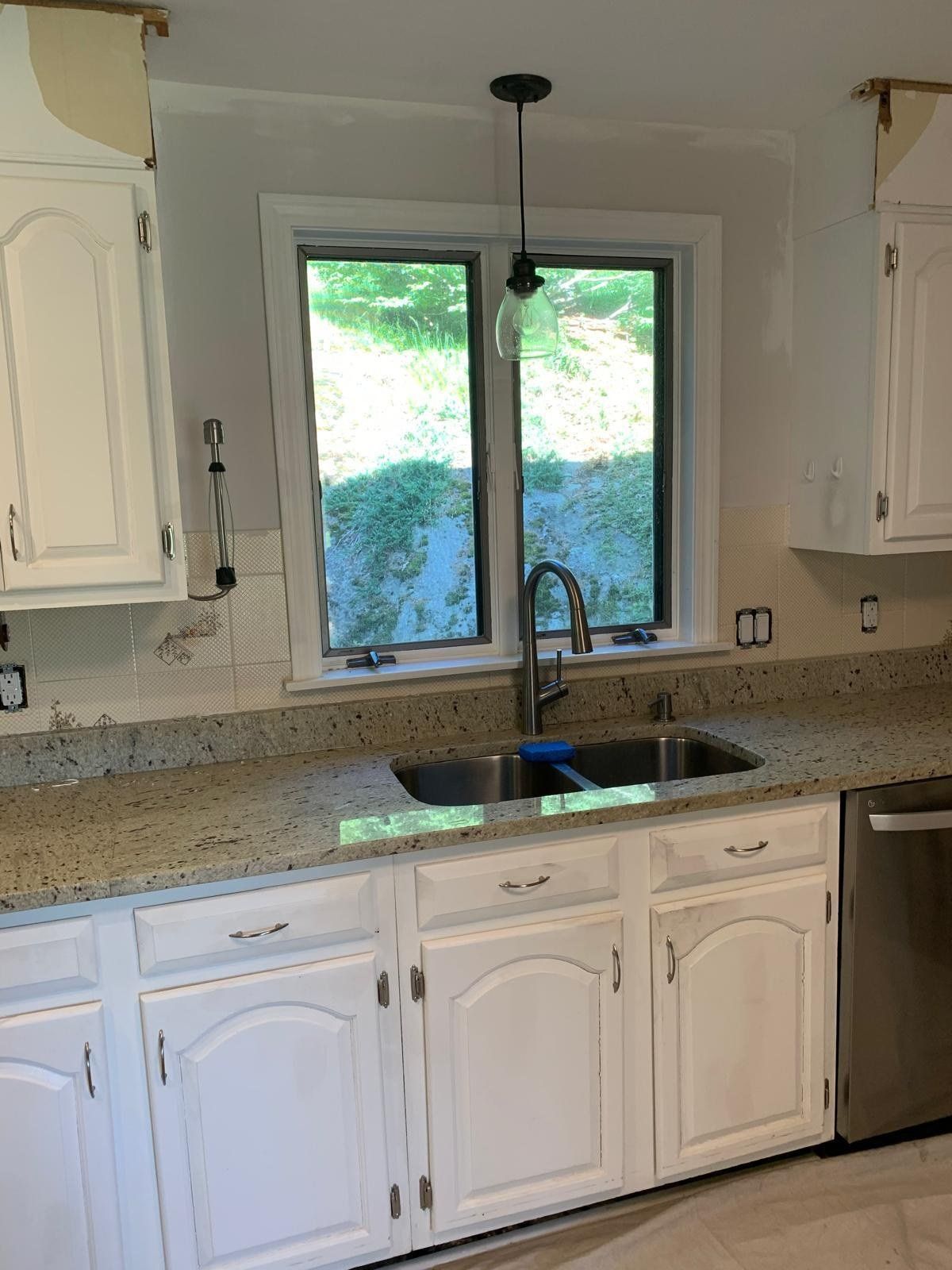 Kitchen with painted white cabinets and granite countertops, Marlborough, MA