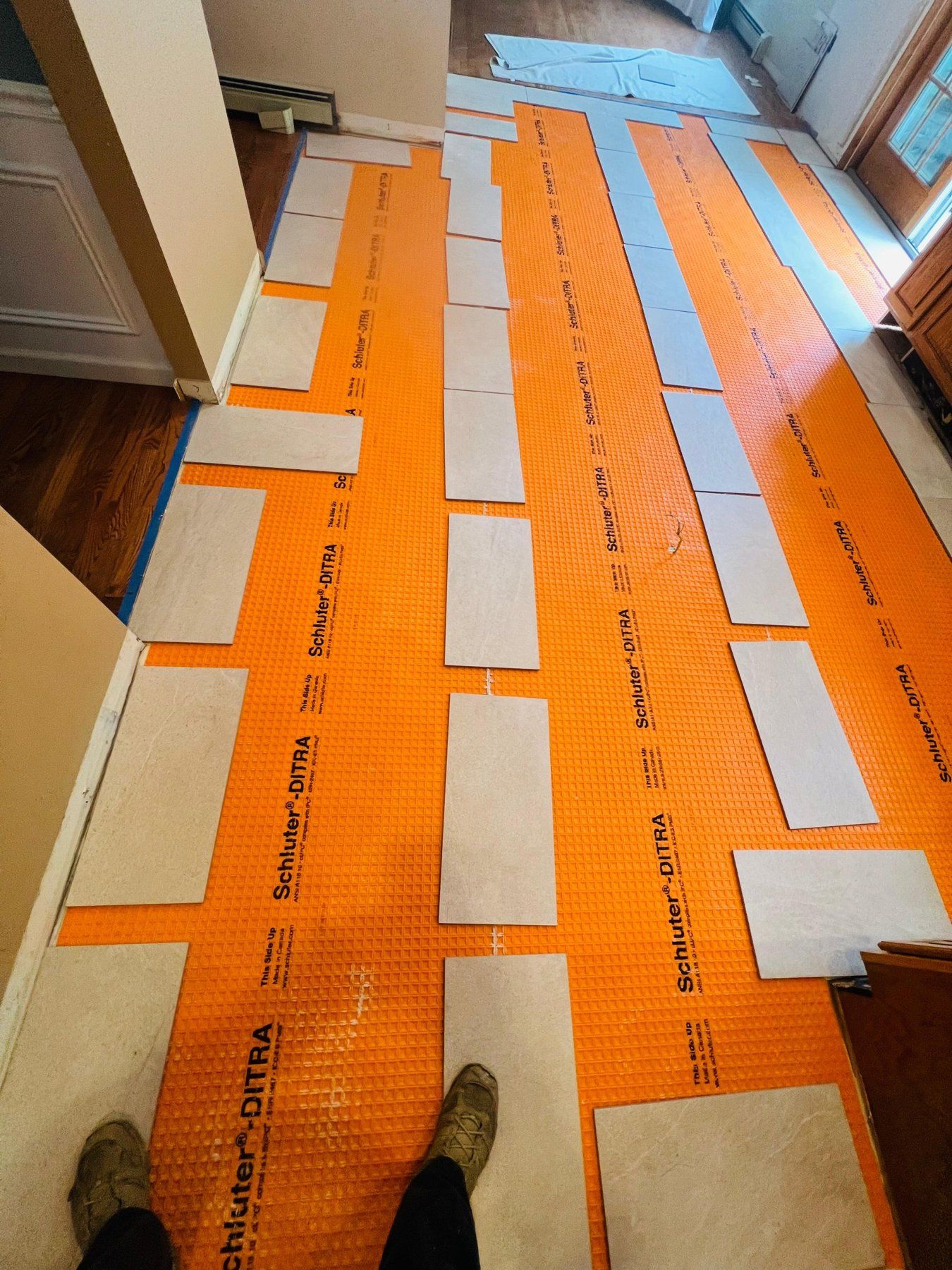 Uncoupling membrane installed under a new tile floor