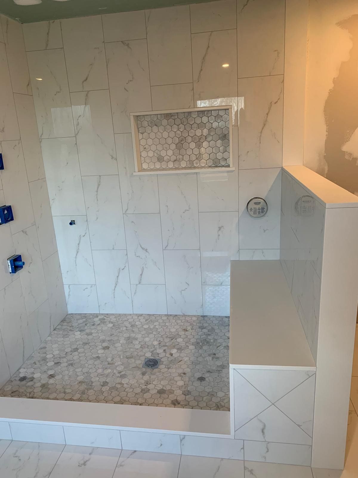 Walk-in shower with tiled bench, recessed niche and hex mosaic floor, Marlborough, MA
